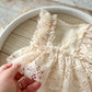 Newborn lace romper with ruffles for professional photography shoots