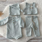 Full 4-piece duck egg blue newborn outfit with romper, hat, vest, and pants