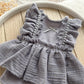 Newborn romper made of muslin fabric  with golden dots, boho style perfect for summer newborn photo shoots