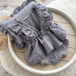 Newborn photo romper and matching ruffled posing pillow