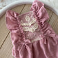 Baby girl photo outfit with lace details on front.