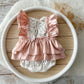 Newborn lace romper with pink satin ruffles and floral lace front