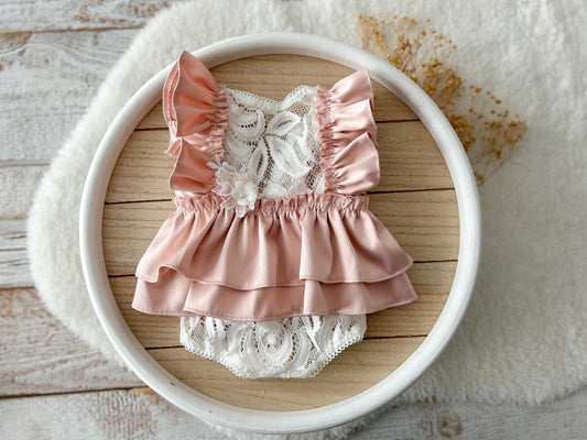 Newborn lace romper with pink satin ruffles and floral lace front