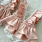 Newborn lace romper with pink satin ruffles and floral lace front


