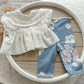 3-piece baby girl photo prop with eyelet top, floral leggings, and matching ruffle pillow