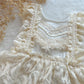 Close-up of intricate lace fabric with a soft focus background