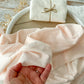 Blush pink newborn wrap for swaddling in newborn photography