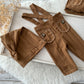 Newborn photo prop set in chestnut brown, including stretchy pants with sewn-in suspenders and cozy sleepy hat.