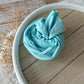 Pale aqua blue swaddle wrap, ideal for newborn photography.