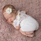 Newborn photo shoot outfit for baby girls. White lace, short sleves and legs, soft, stretchy. V cut back.