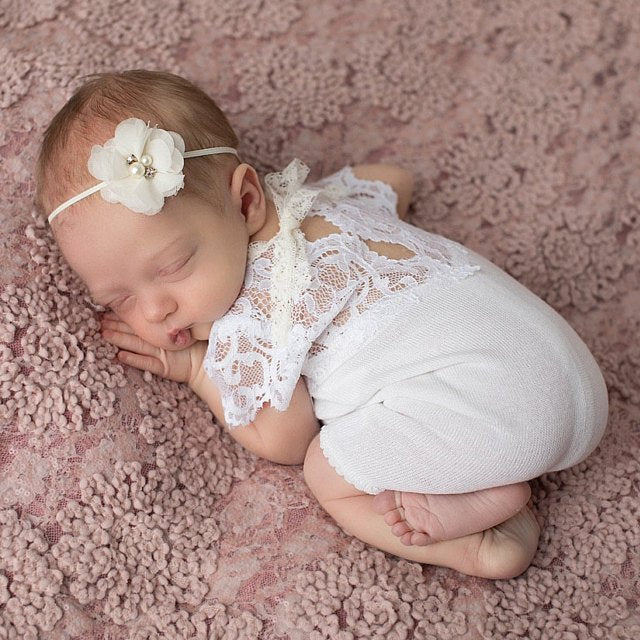 Newborn photo shoot outfit for baby girls. White lace, short sleves and legs, soft, stretchy. V cut back.