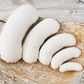 Set of 5 bean-shaped newborn posing pillows arranged on a neutral background