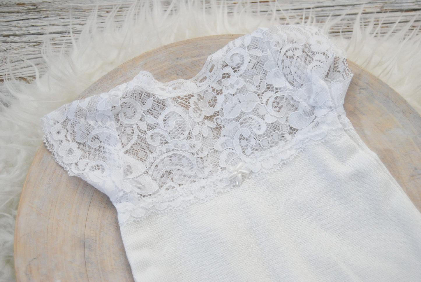 White lace romper for newborn photo shoots. Soft, stretchy jersey fabric for the bottom part, dainty lace with intricate details on top.