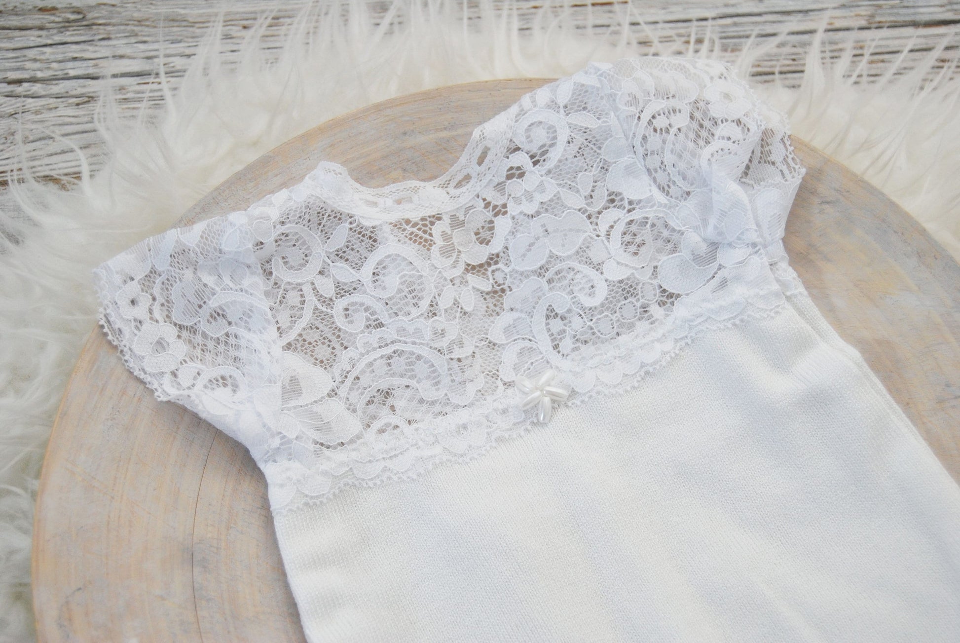 White lace romper for newborn photo shoots. Soft, stretchy jersey fabric for the bottom part, dainty lace with intricate details on top.