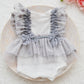 The front of the baby romper, gray color, stars, lace and bows. Perfect for newborn photo sessions