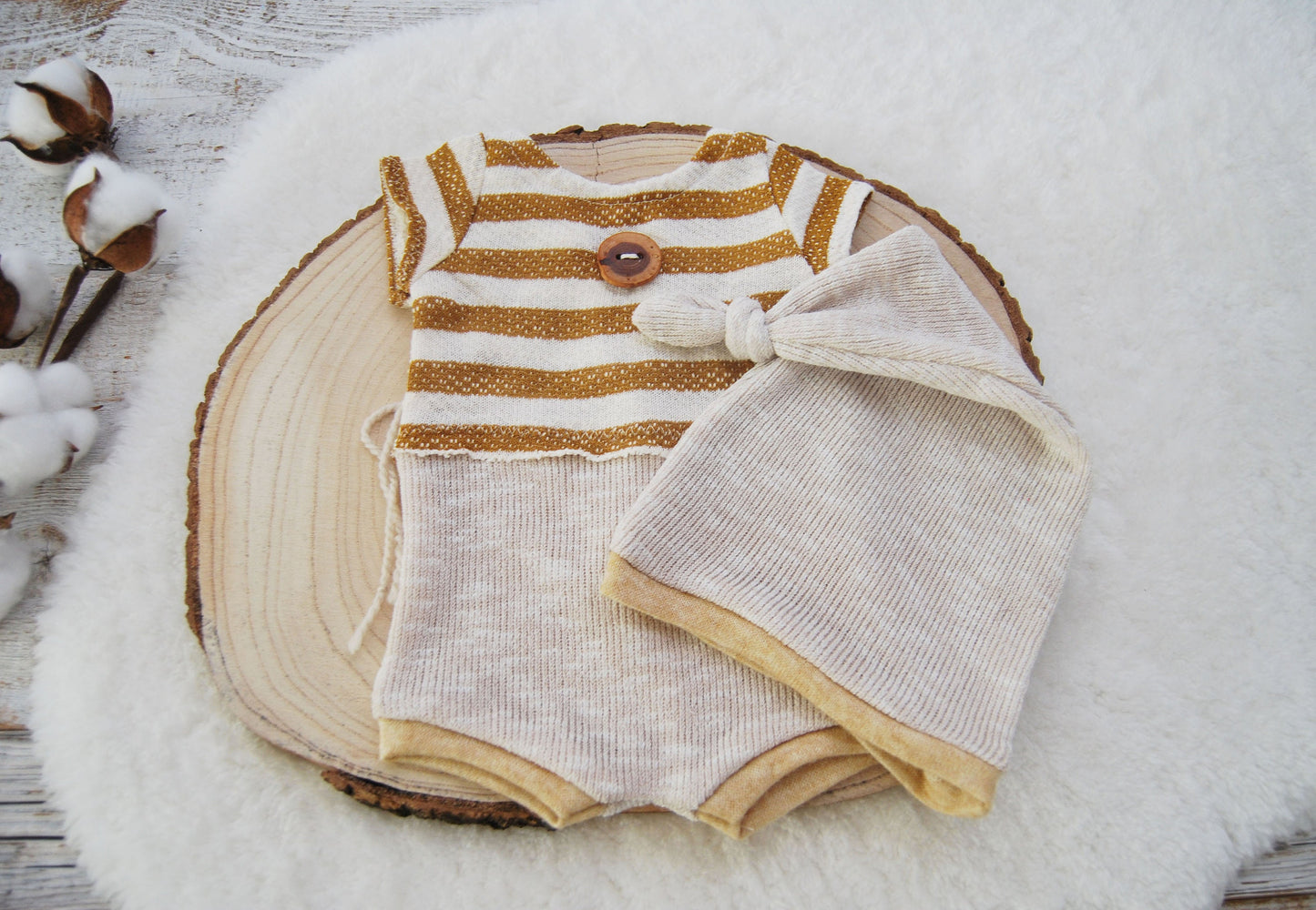 Newborn boy romper and hat for photography sessions. Made of soft and stretchy fabrics in a combination of mustard and beige. The top features stripes while the bottom is plain. Perfect for first photo shoot