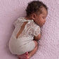 An example of the same newborn girl outfit in gray.